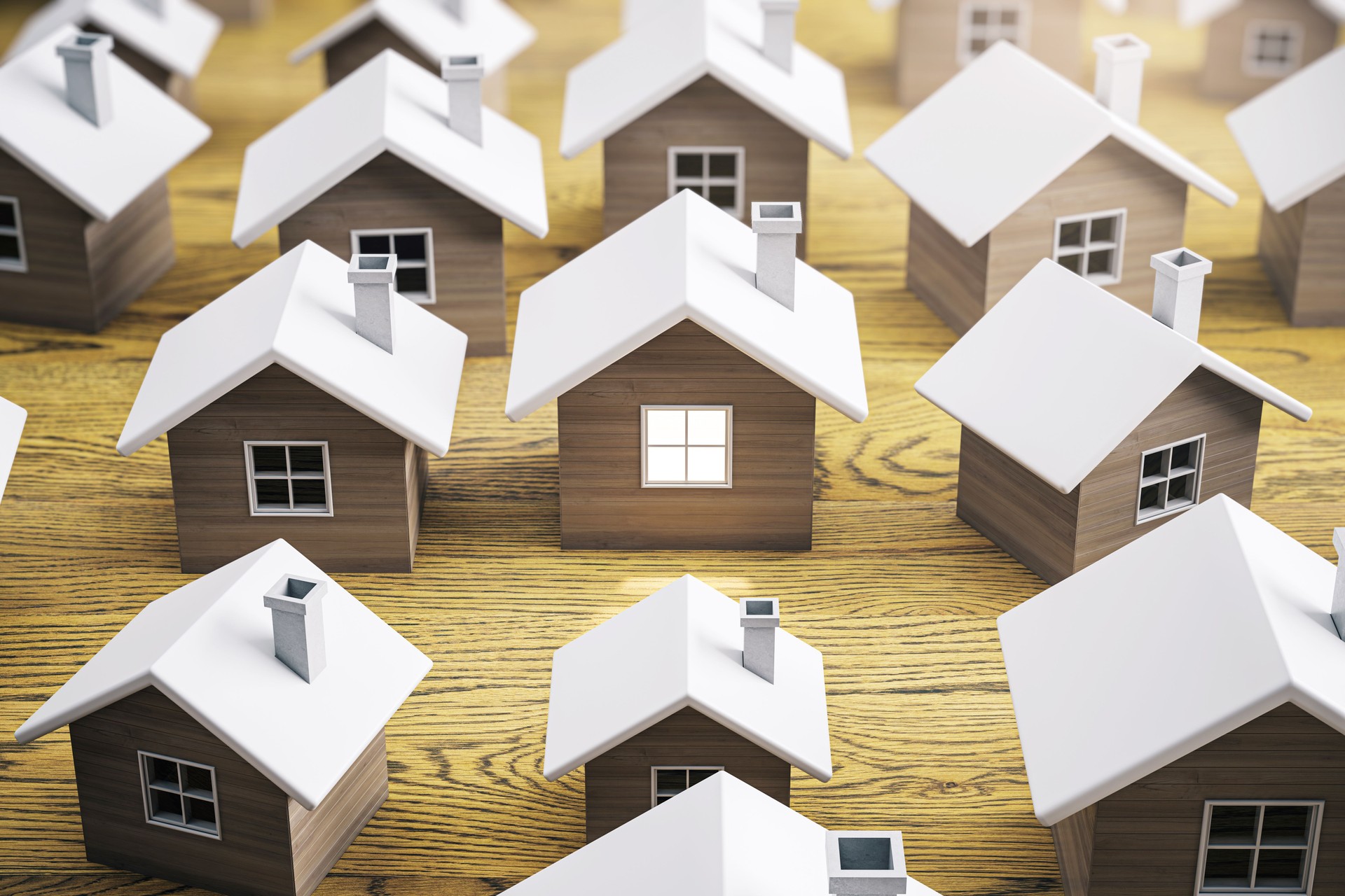 Miniature 3D houses on a wooden background, symbolizing real estate market or property concept. 3D Rendering