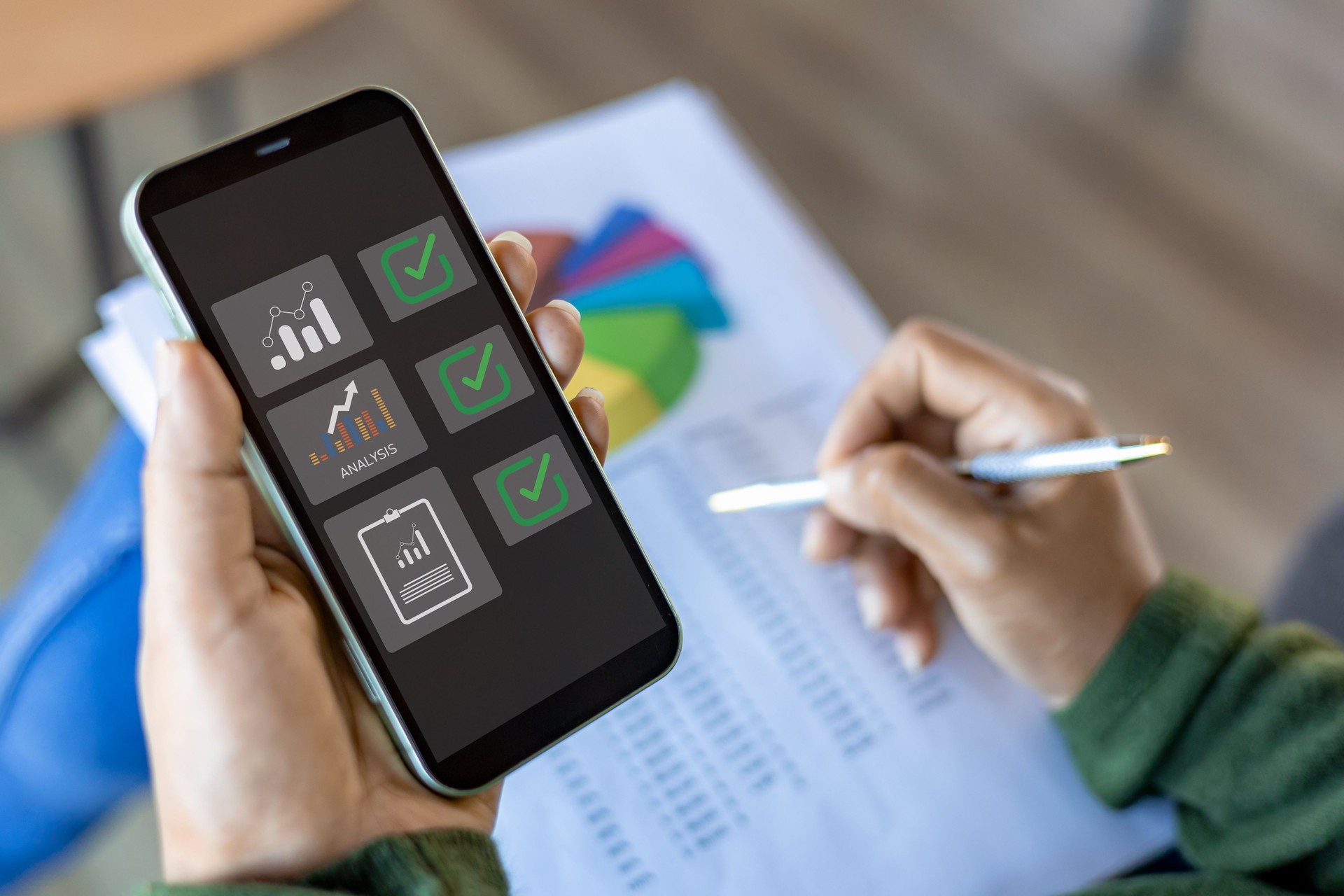 Using mobile smartphone, Business woman working with balance sheet of accounting for calaulating finance, tax, accounting, statistics and analytic research concept.